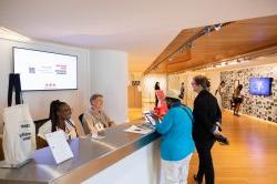 Visitors check in at the front desk of the Segal Gallery.