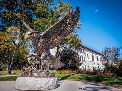 Front photograph of the Hawk Statue outside of College Hall.
