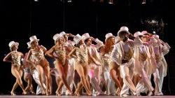 Large group of students performing in A Chorus Line